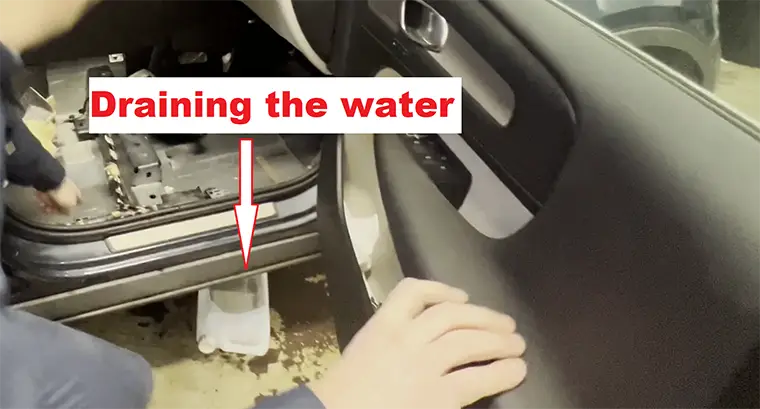 Draining the water from inside the Volvo